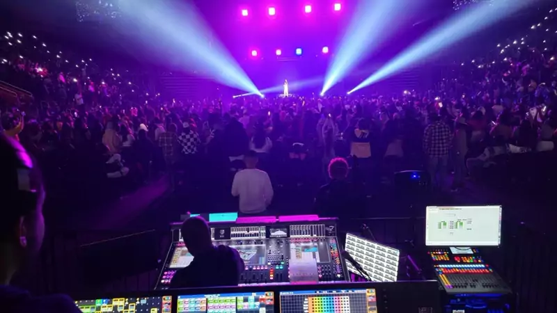 Concert crowd under stage lights